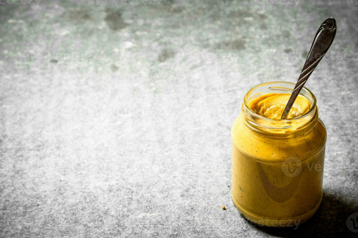 Fresh mustard in a jar photo