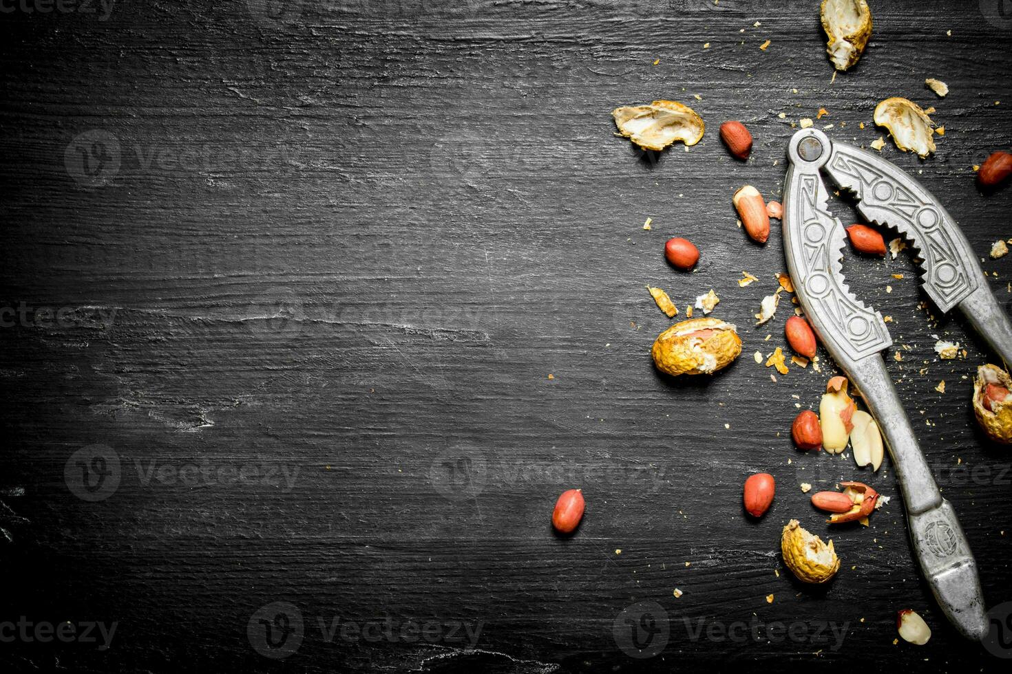 Shelled peanuts with the shell and a Nutcracker. photo