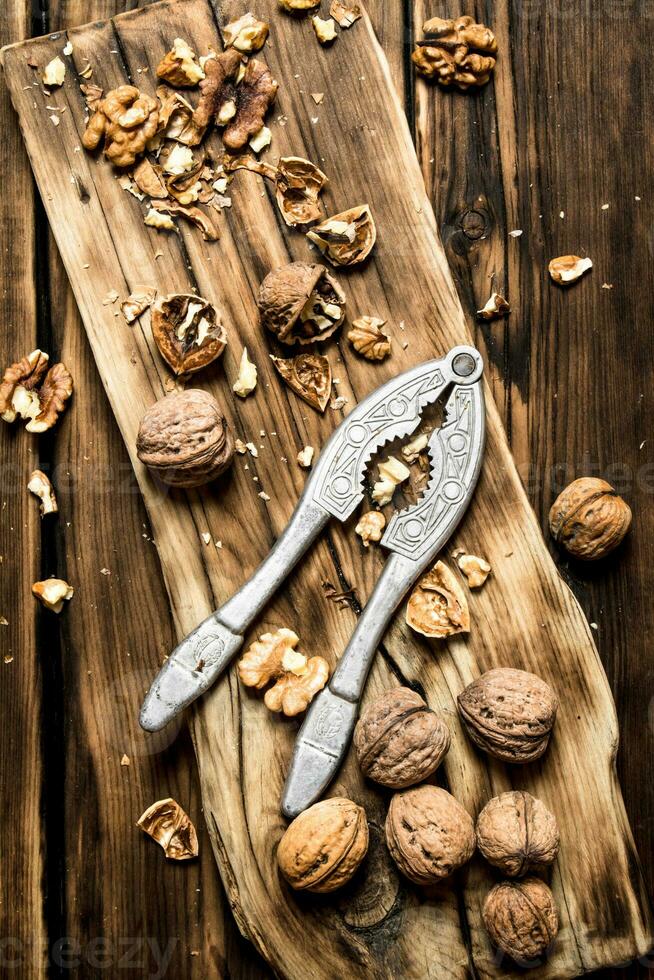 Walnuts with Nutcracker on the Board. photo