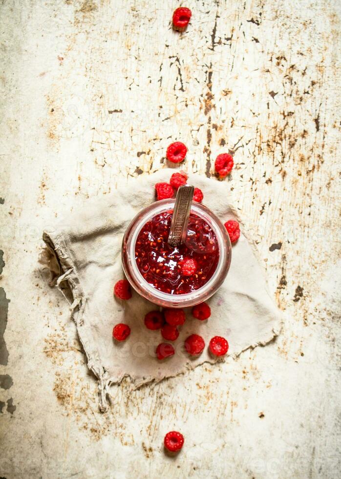 Jam from wild raspberries in the jar. photo
