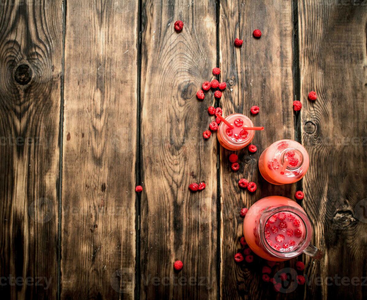 Raspberry juice in the pitcher. photo