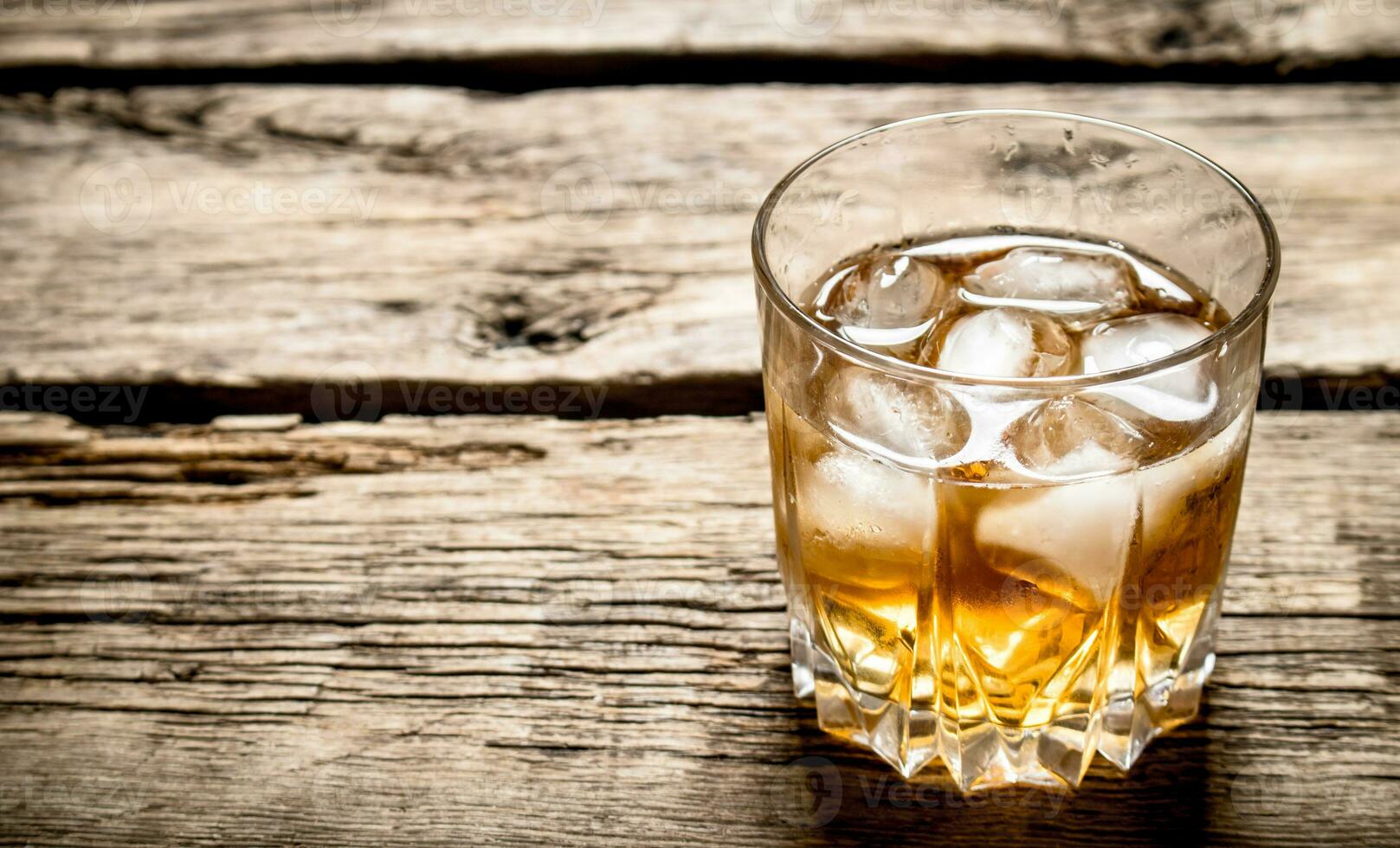 glass of rum and ice. photo