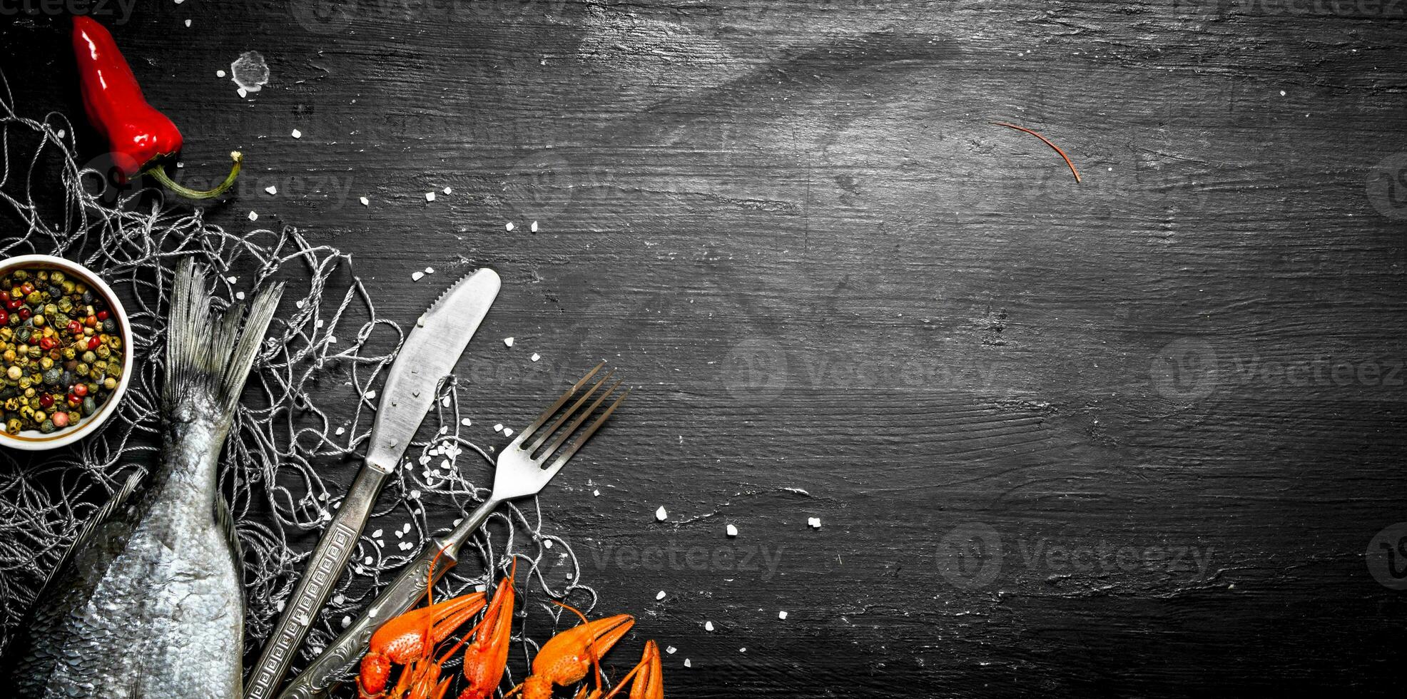Fresh fish and shellfish on a fishing net. photo