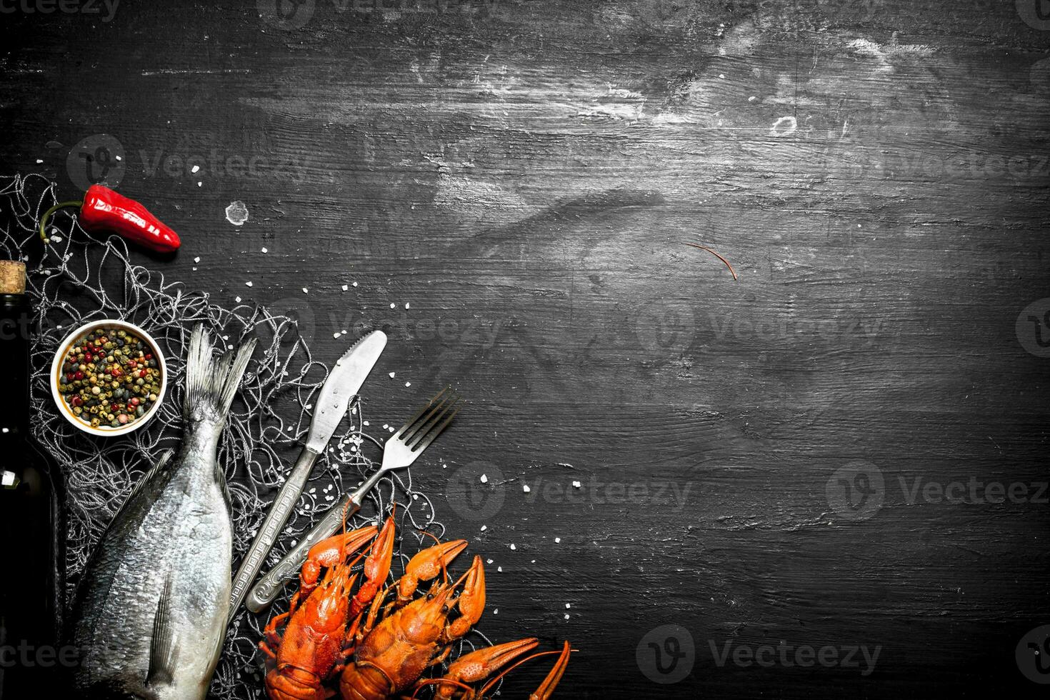 Fresh fish and shellfish on a fishing net. photo