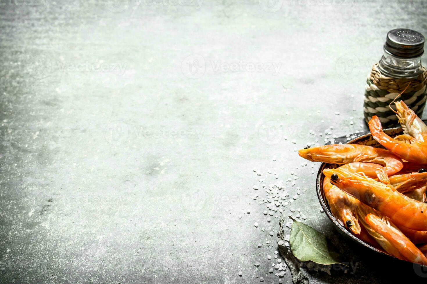 Shrimp with salt and Bay leaf. n the stone table. photo