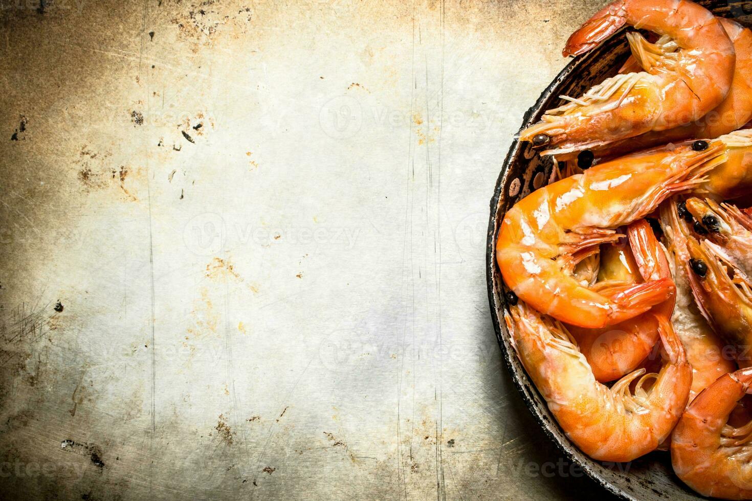 Shrimp in an old pan. photo