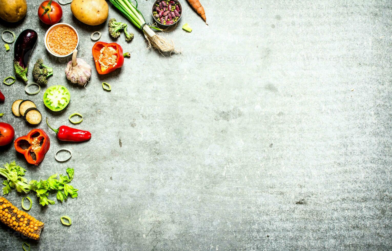 Organic food. Fresh slices of vegetables with spices. photo
