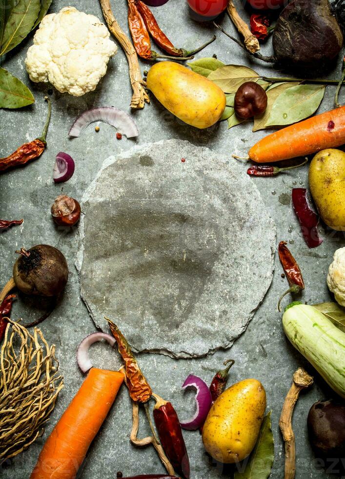 Ingredients for soup with plate in the middle. photo