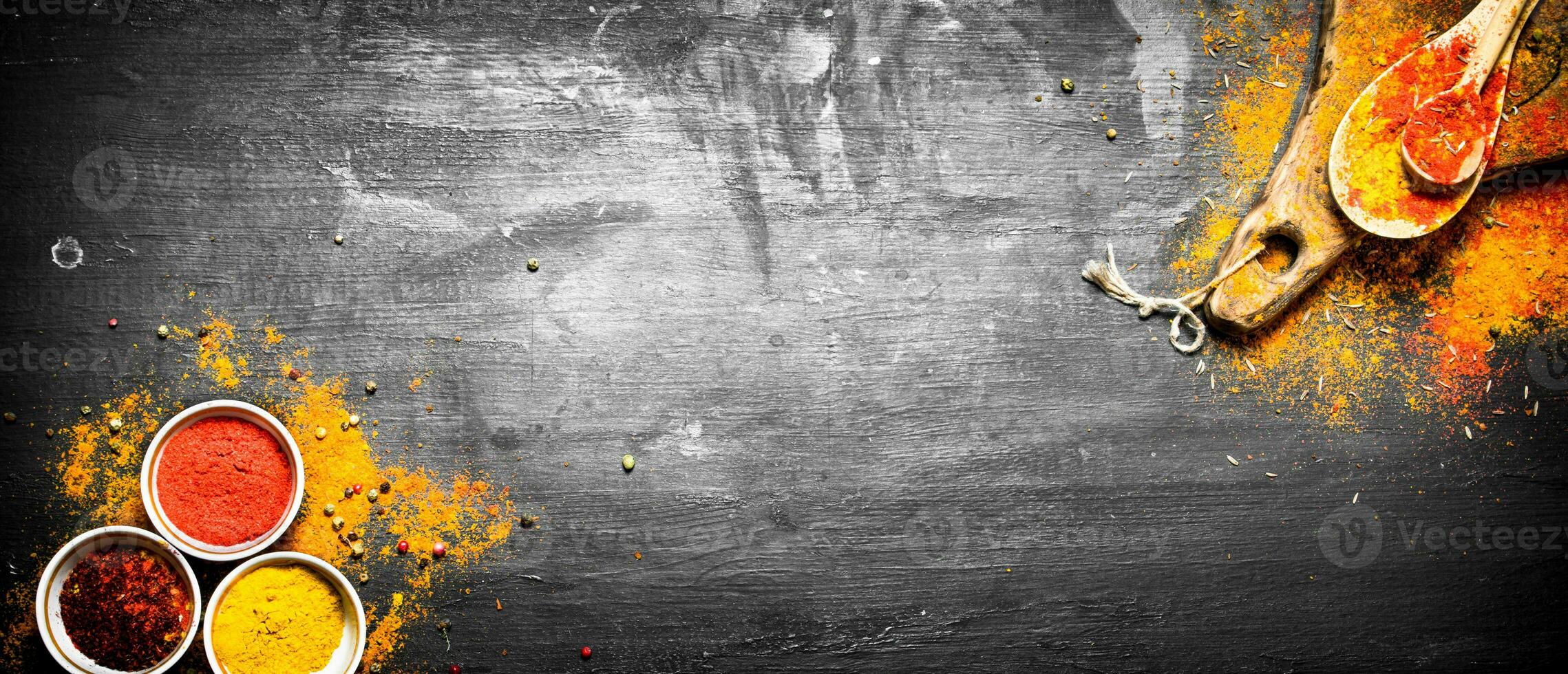 Ground colorful Indian spices and herbs. photo