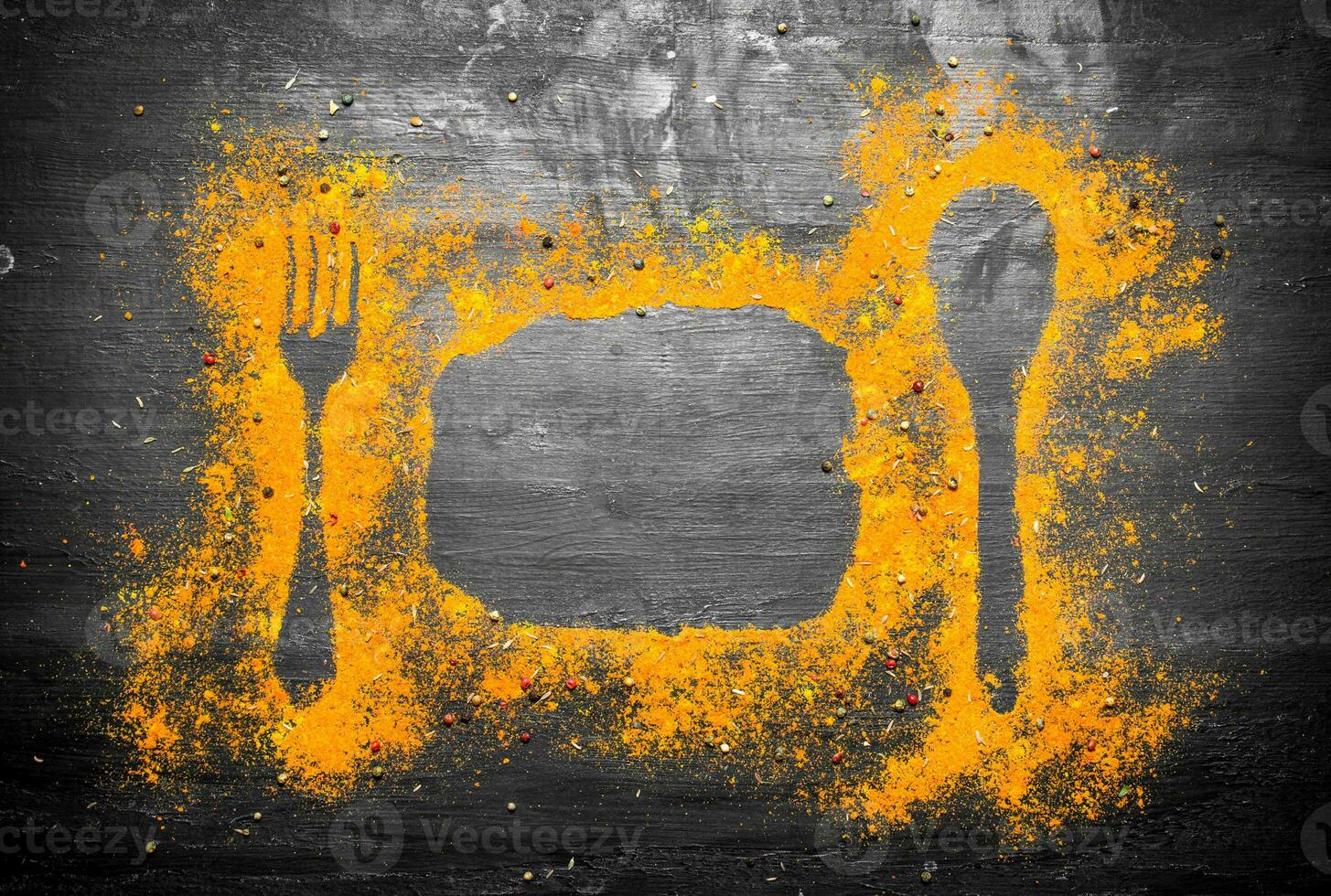 Print of Indian spices from fork, spoon and plate photo