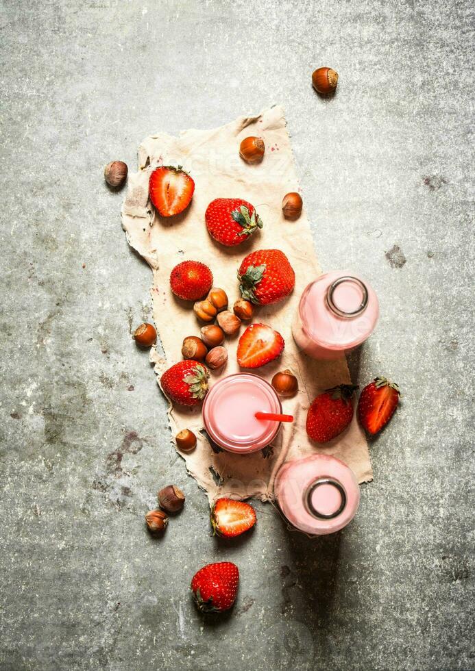 Strawberry juice with nuts on the old fabric. photo