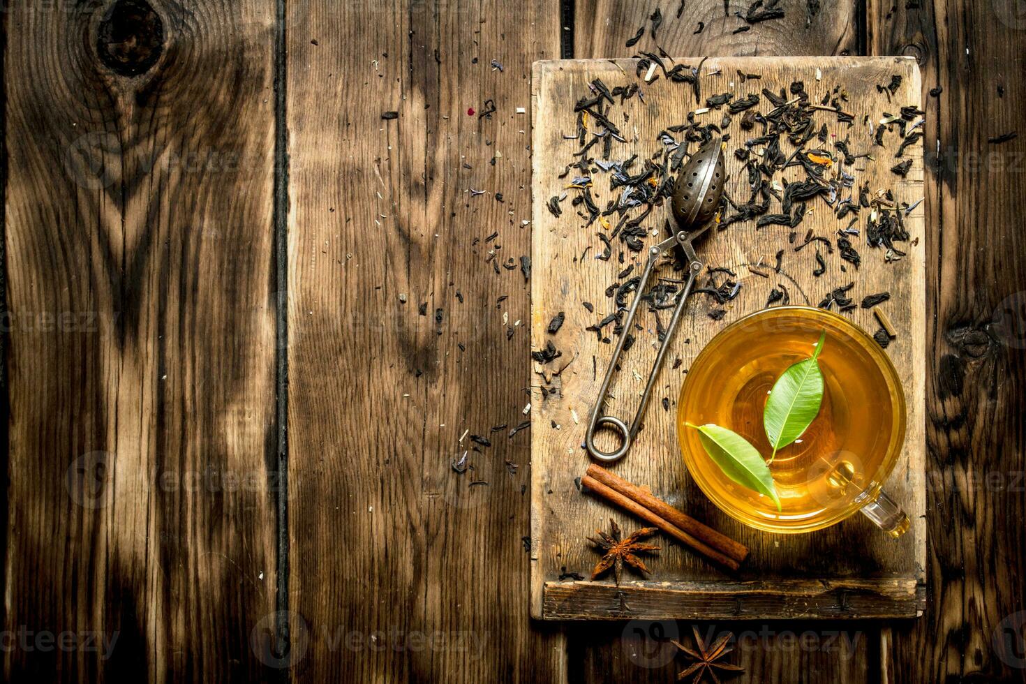 Cup of tea with green leaves. photo