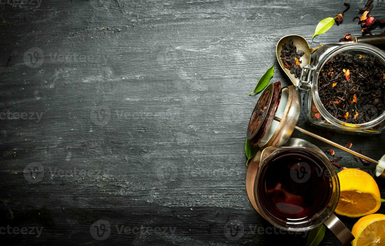 Teapot with tea and lemon. photo