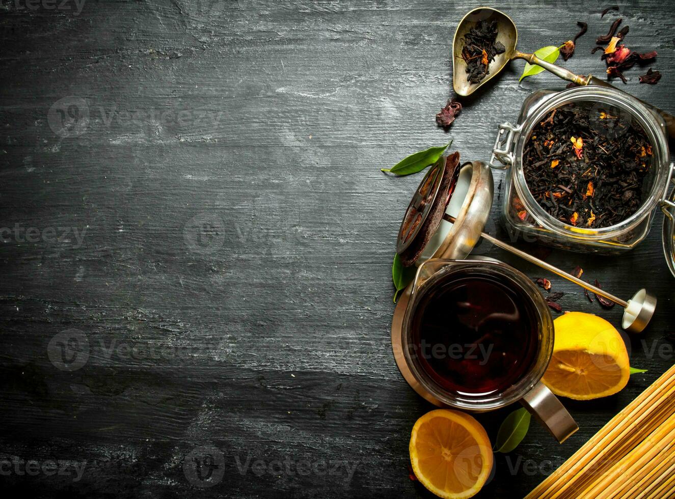 Teapot with tea and lemon. photo