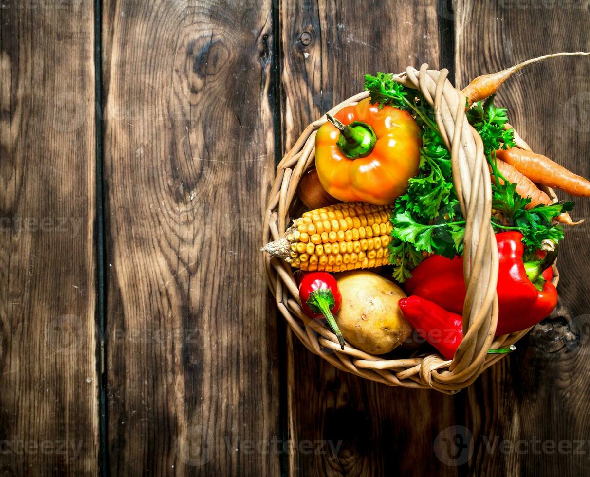 Organic food . Fresh vegetables in the old basket. photo