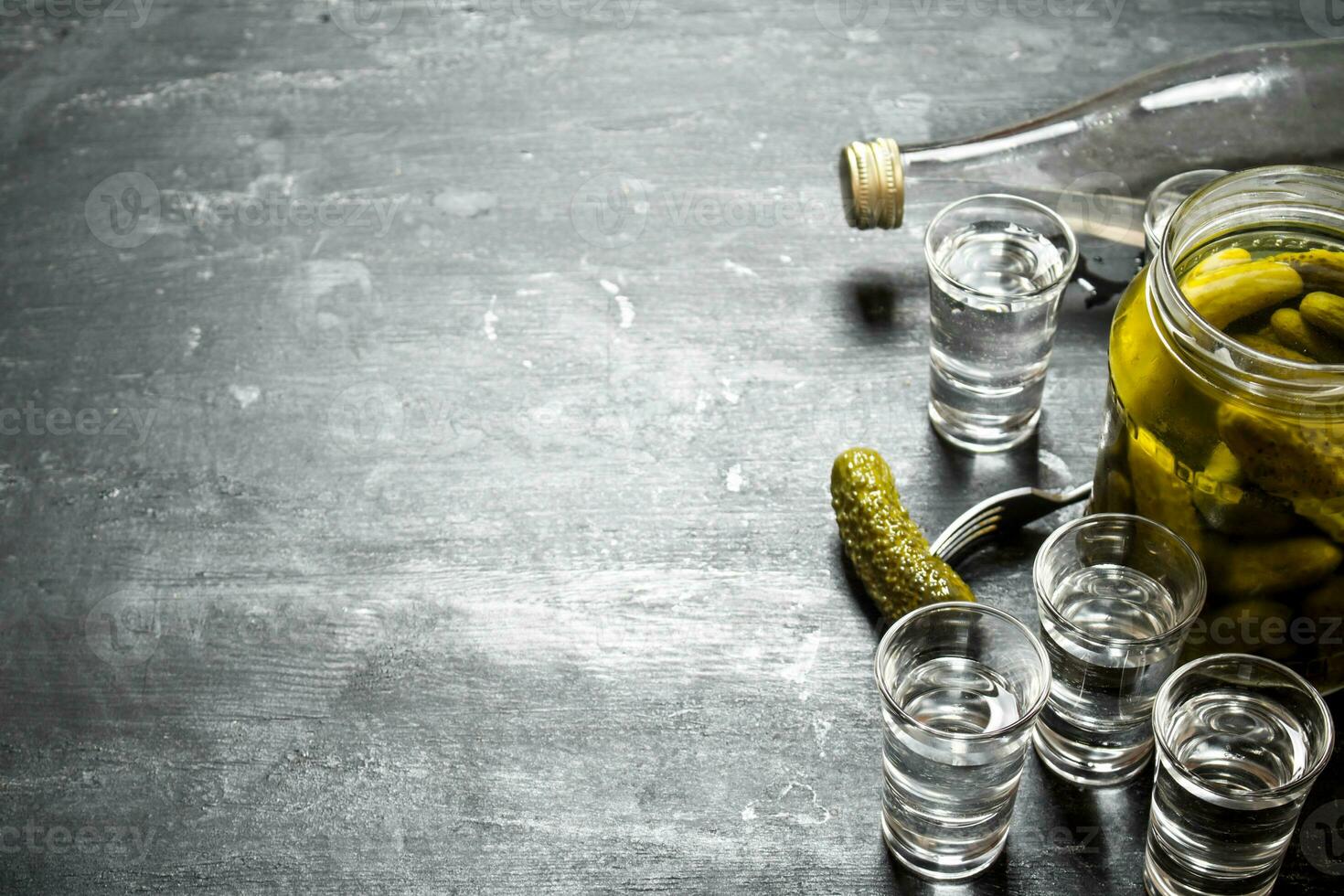 Vodka with pickled cucumbers. photo