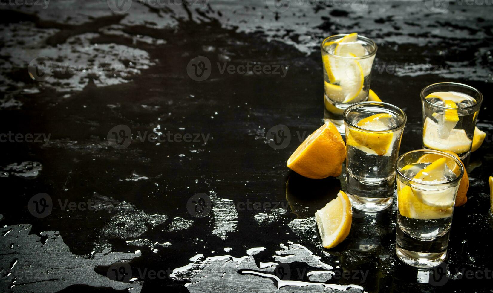 Glasses with vodka and lemon. photo