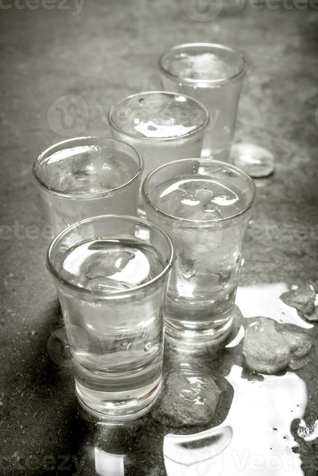 The vodka glass with ice. photo