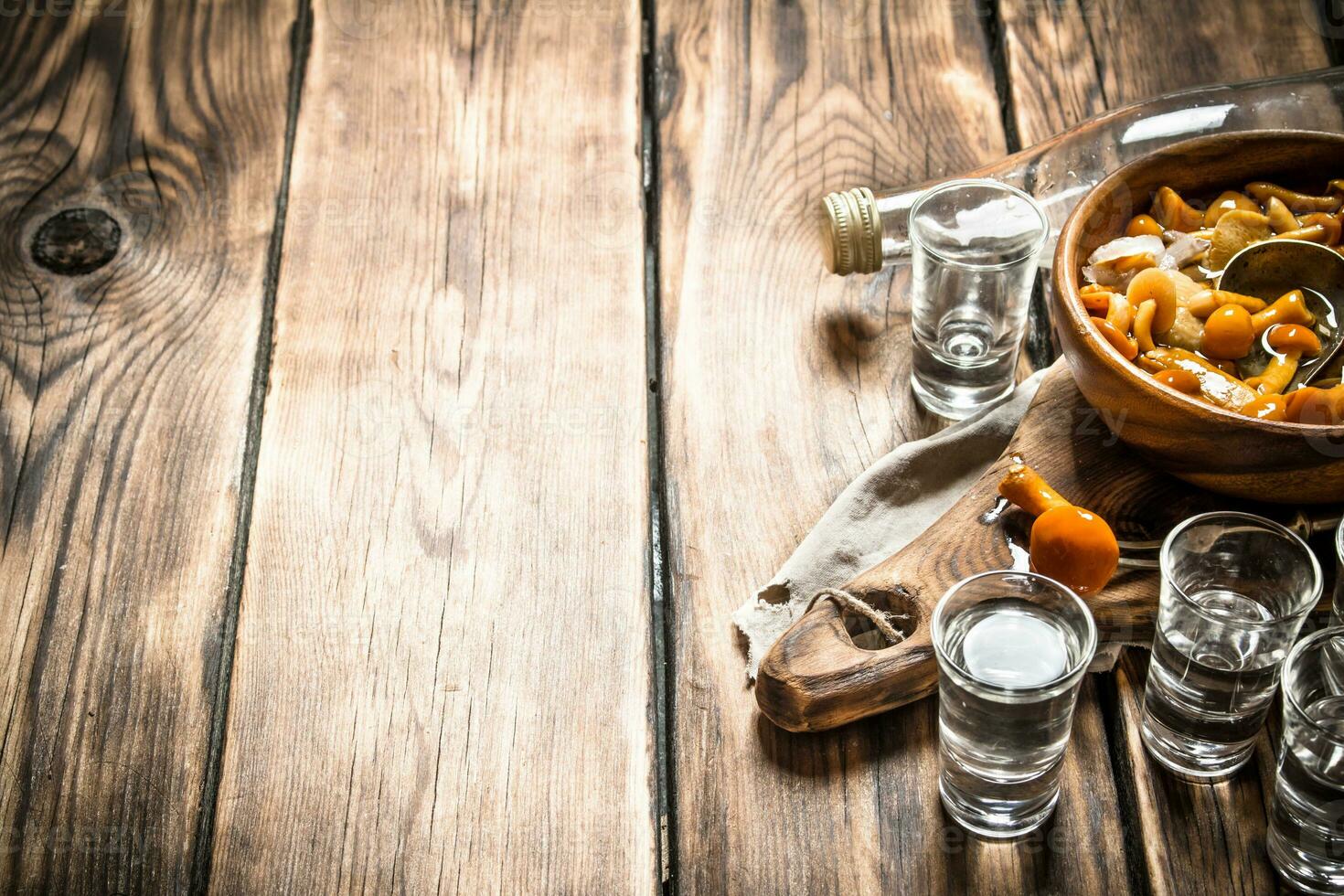 Russian style. Vodka with pickled mushrooms. photo