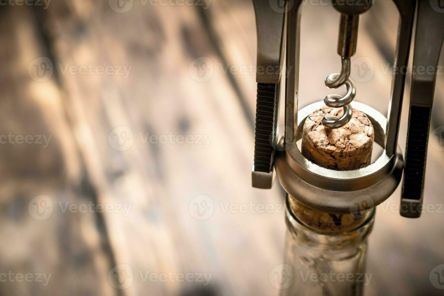 bottle of wine with corkscrew. photo