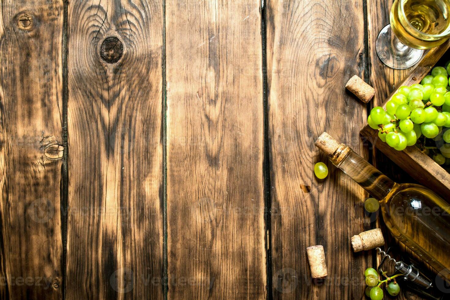 White wine with a box full of grapes. photo