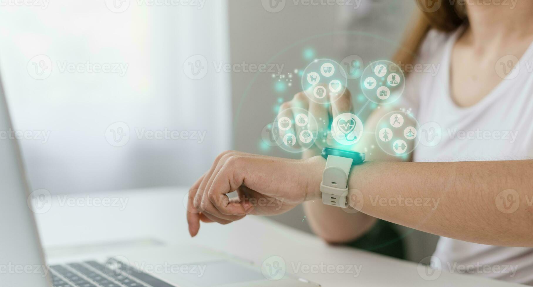Digital and Healthcare trends, Woman using smartwatch to track health, digital health concept, with holograms of healthy food, mental health care, exercise, and doctor's appointments photo