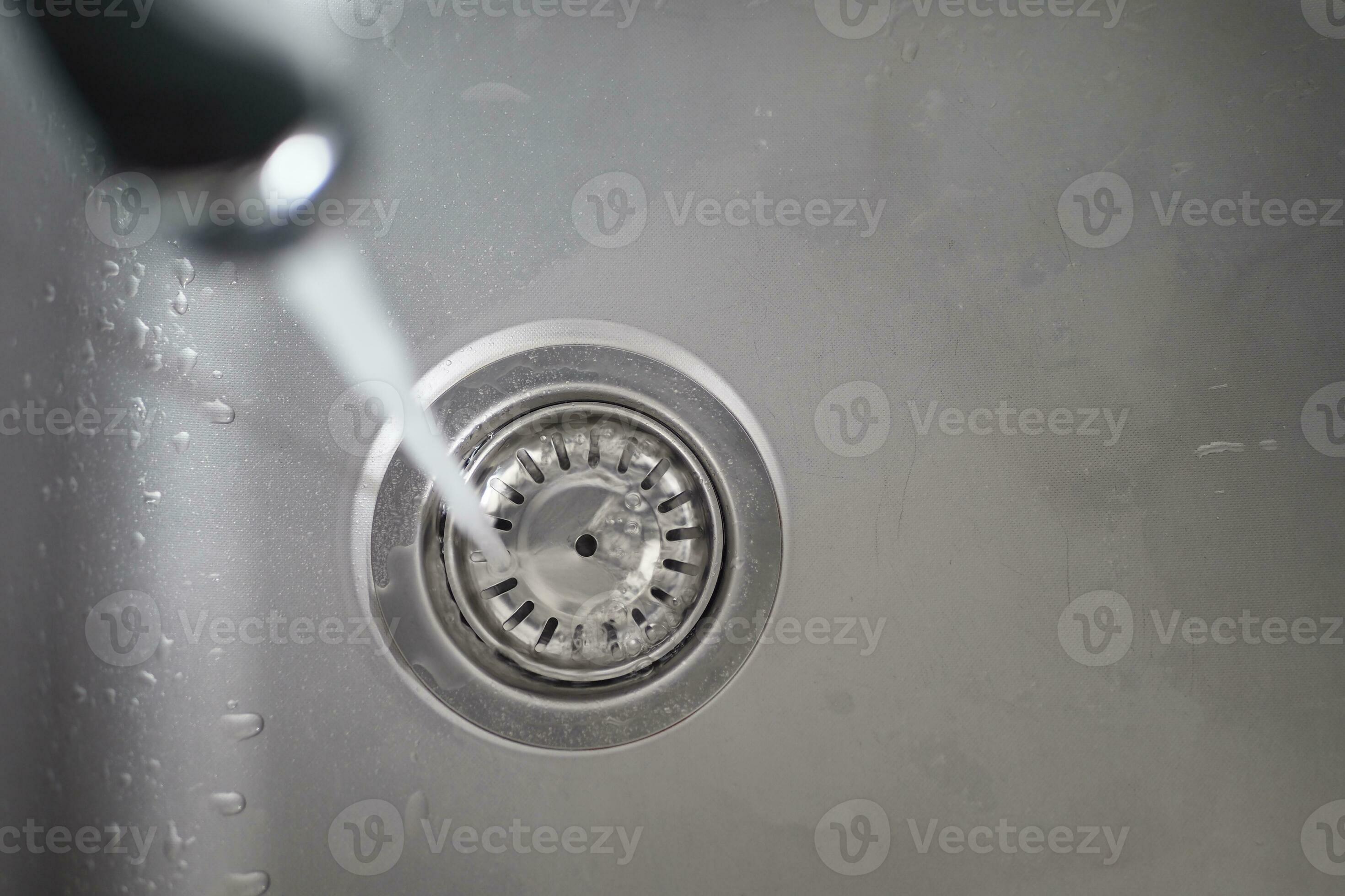water pouring from a faucet tap slow motion 32036000 Stock Photo at
