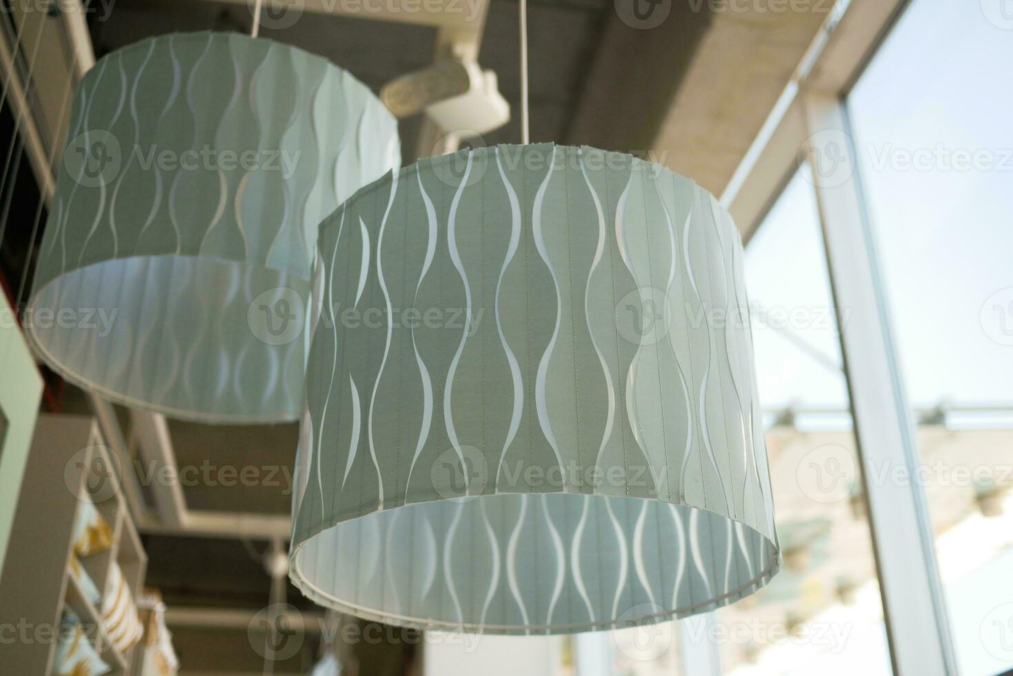 gray ceiling lamp hanging in a room , photo