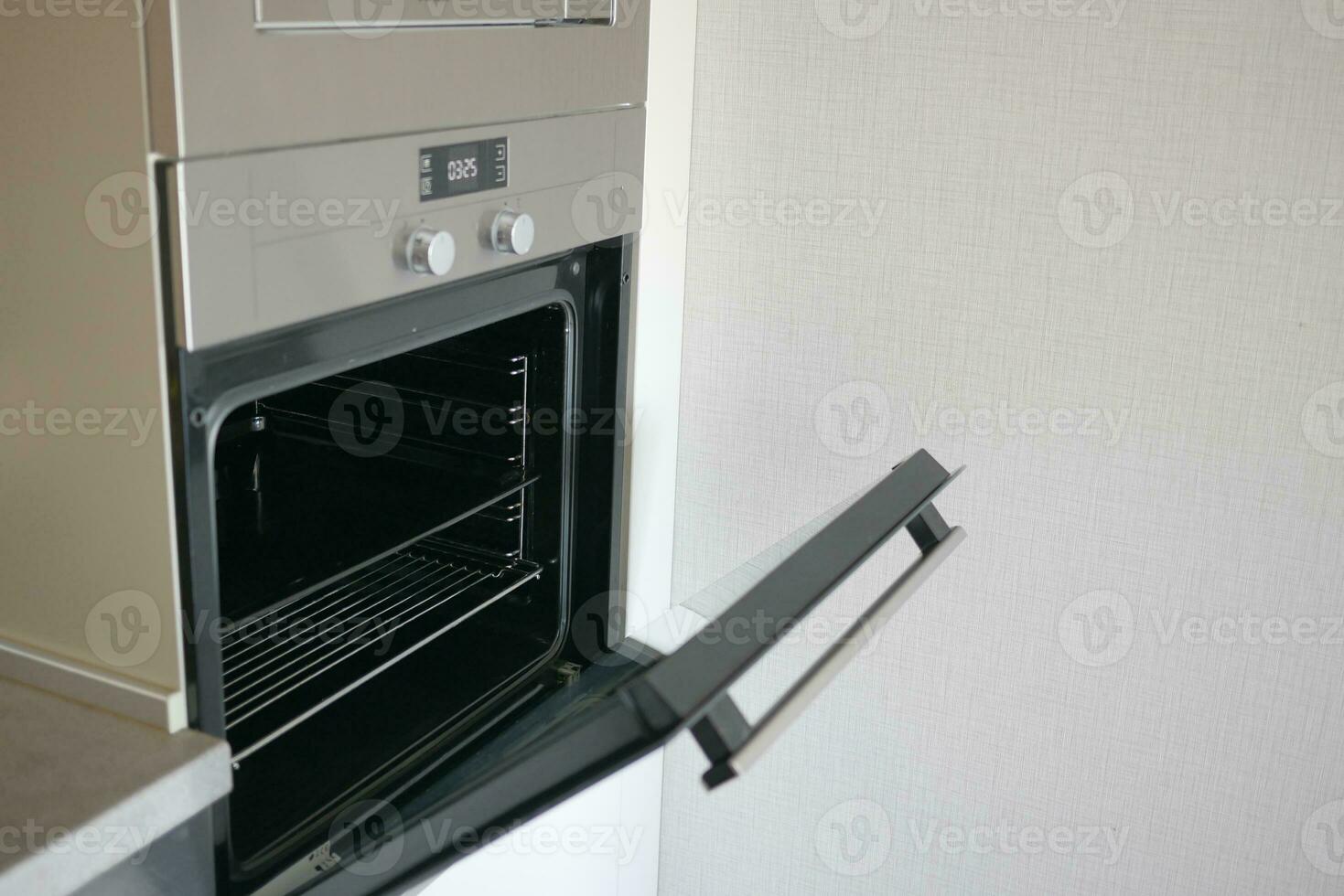 open electric oven at home photo