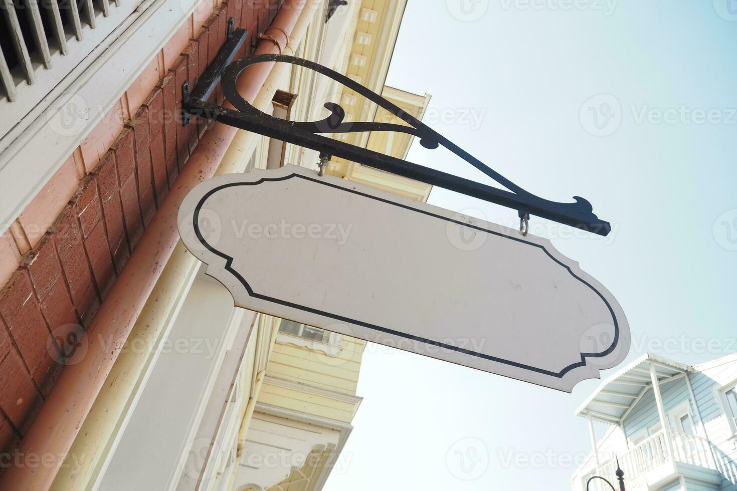 Street signboard mockup on modern city building photo