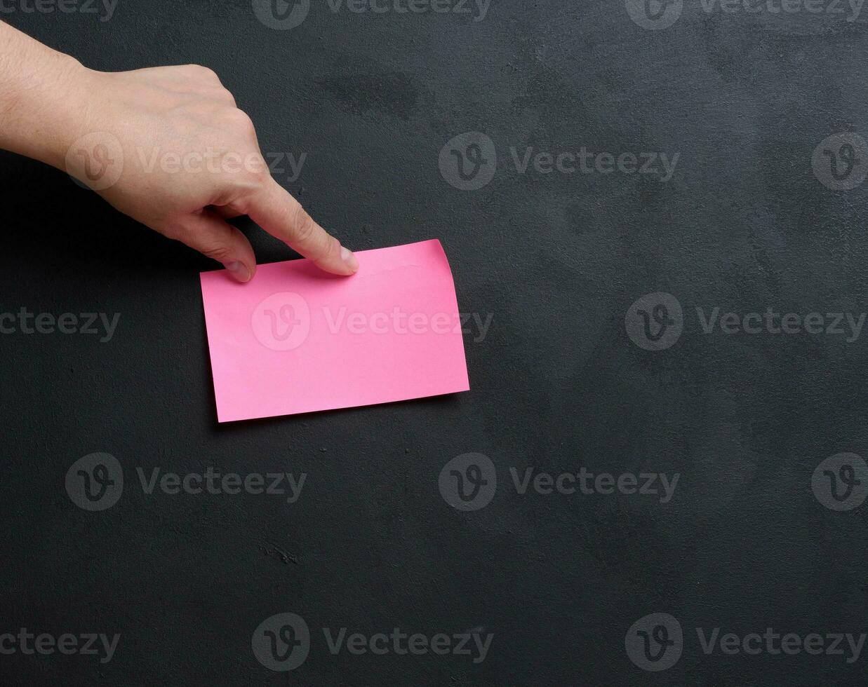 Representing the concept of searching for solutions and answers to questions, hand hold paper sticker photo