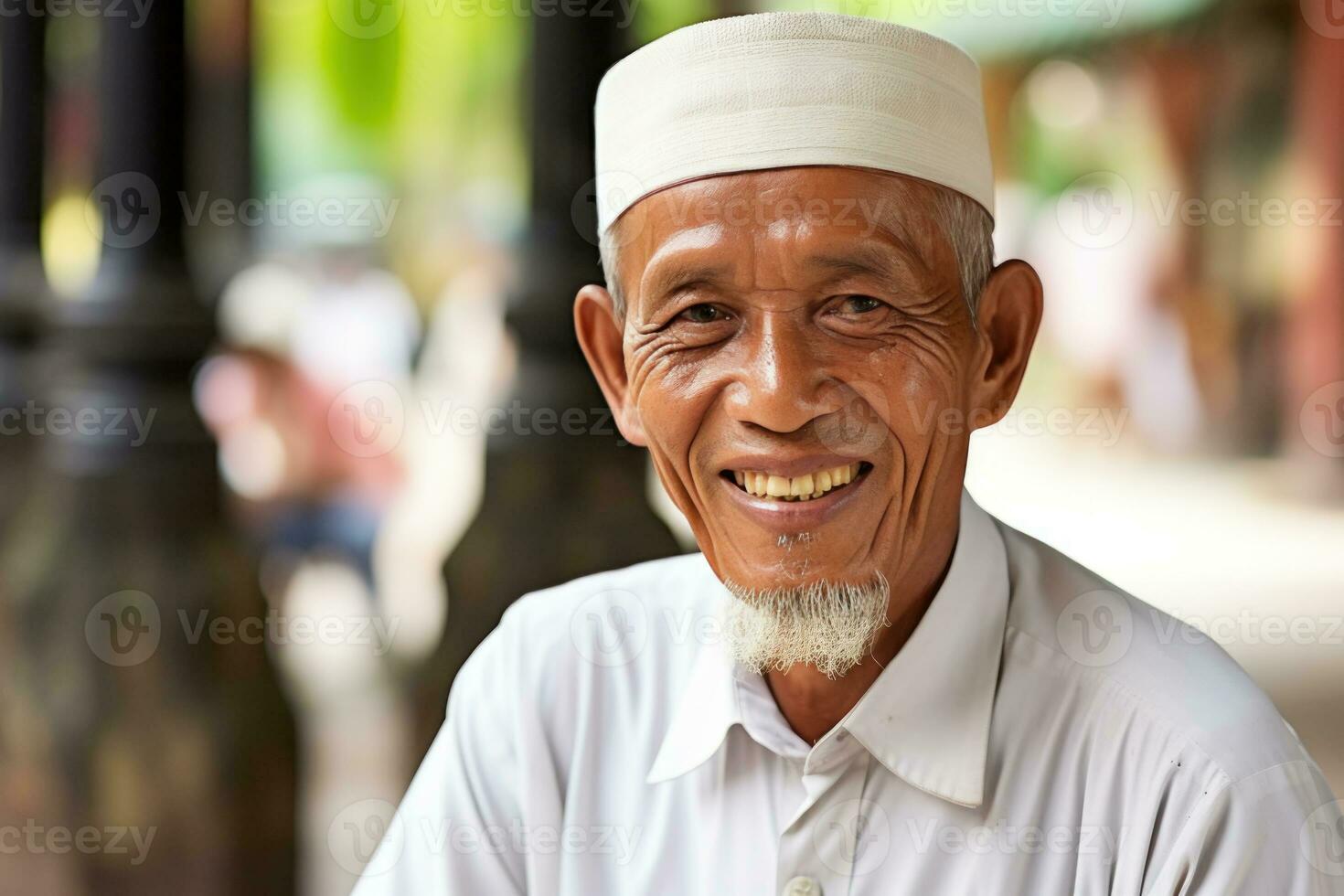 Portrait of a smiling senior Malay man with kufi. AI Generated photo