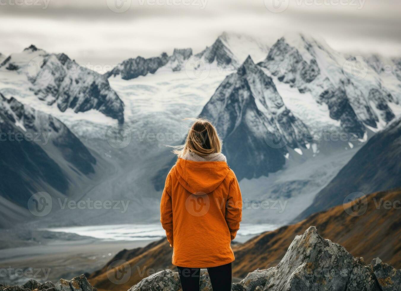 Back view of a female hiker looking at the mountain. AI Generated photo