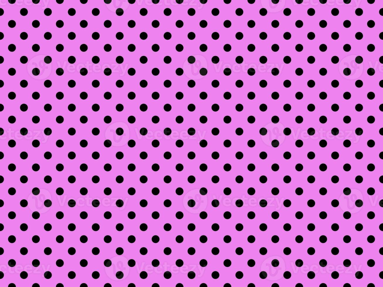 black polka dots over violet background photo