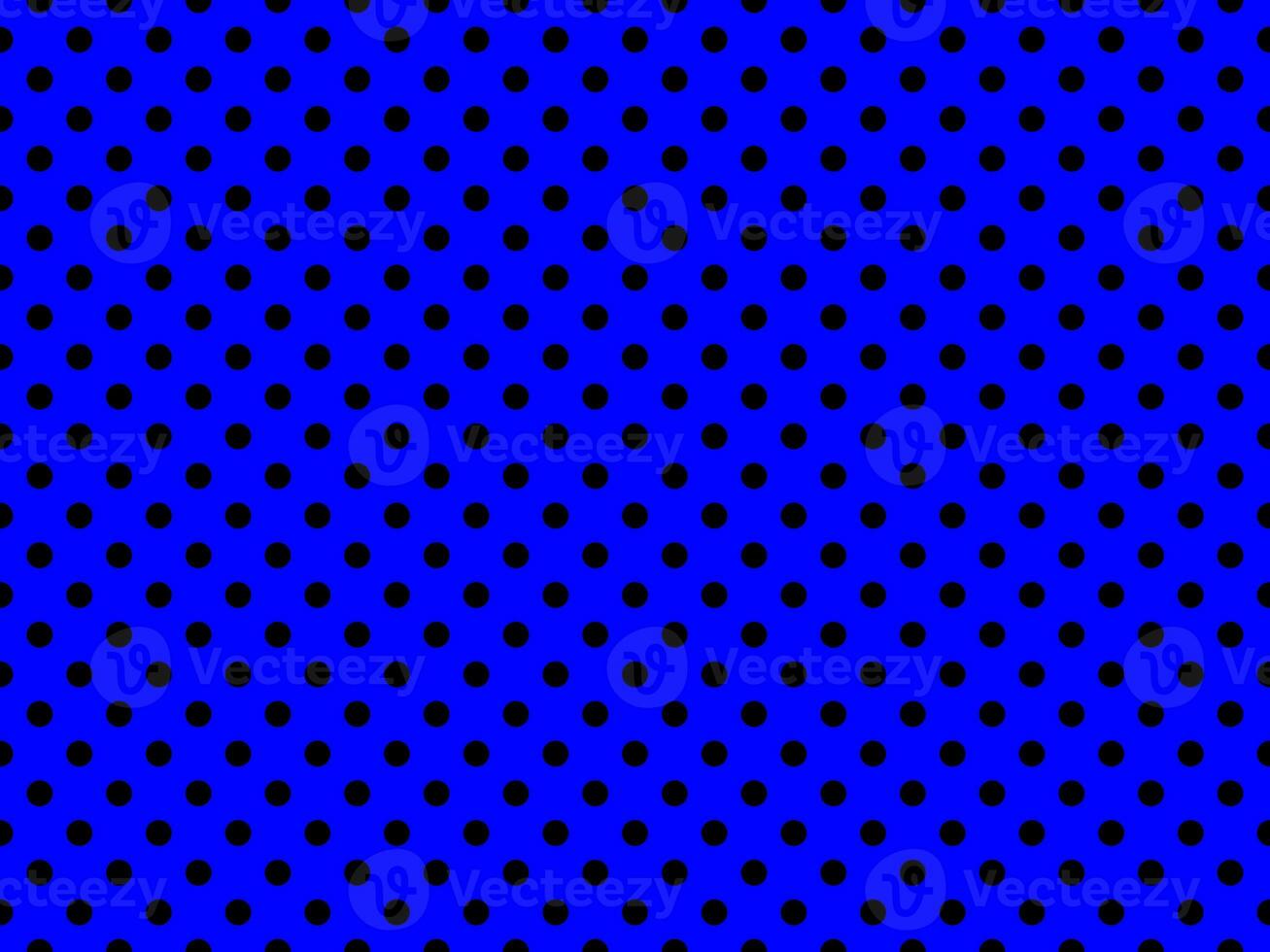 black polka dots over blue background photo
