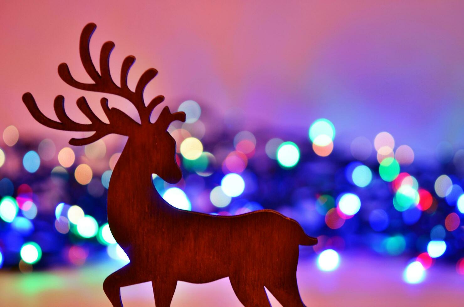 Christmas background with deer silhouette. photo