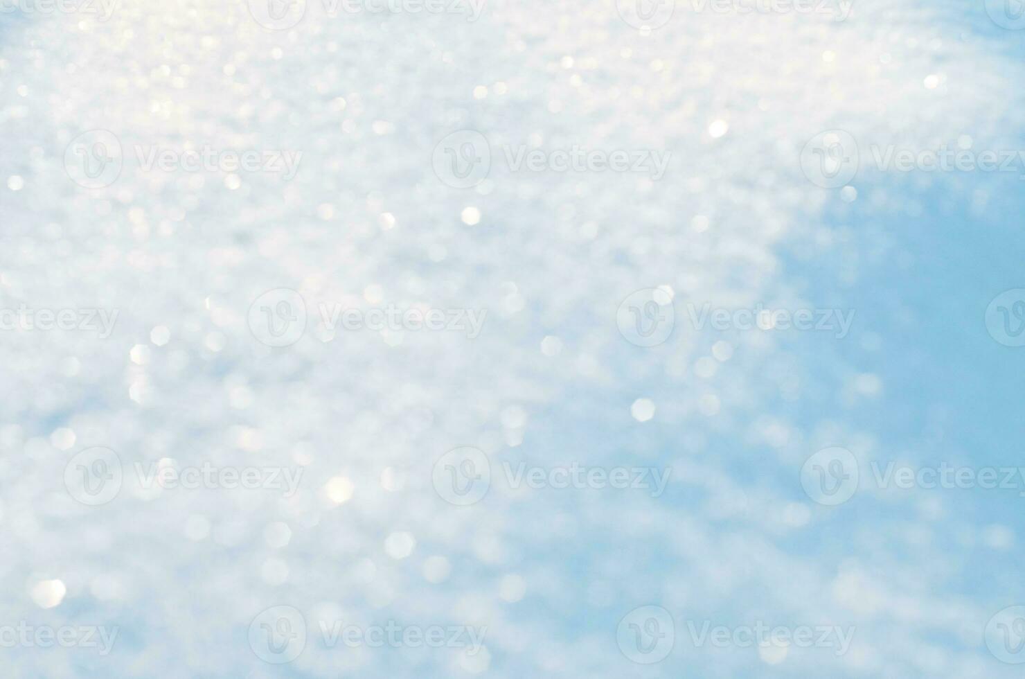 Snow sparkle background. Abstract blue bokeh background. photo