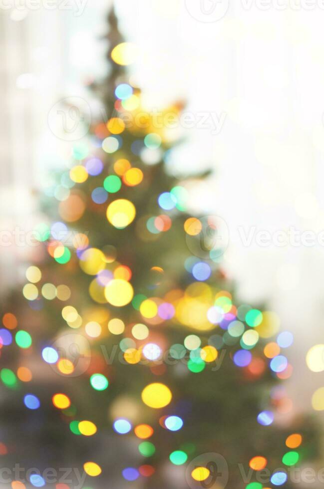 defocused light bokeh of christmas light tree,happy new year and Christmas holiday background photo