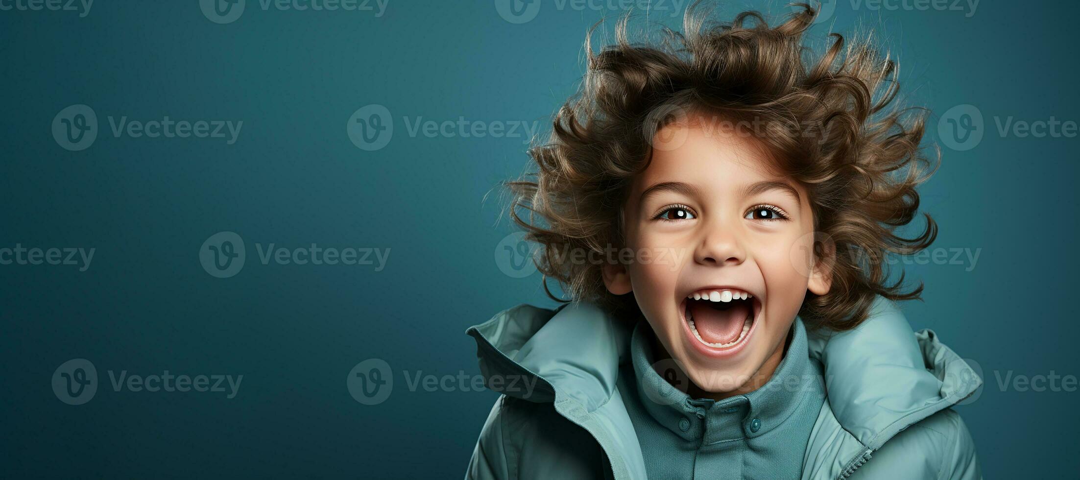 Little boy exited smiling on blue background.Generative AI photo