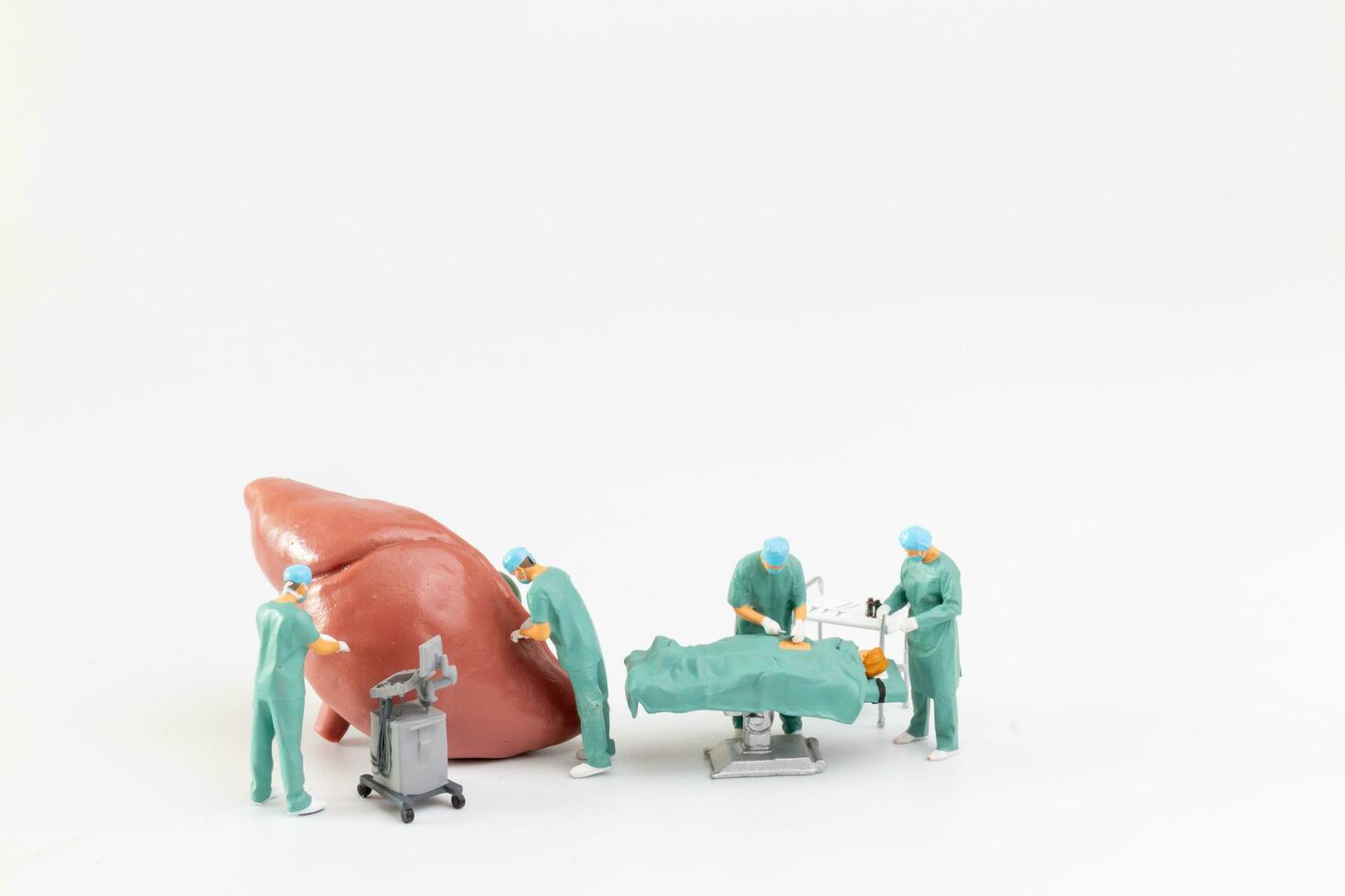 Miniature people, Doctor and nurse medical team are performing surgical operation at emergency room photo