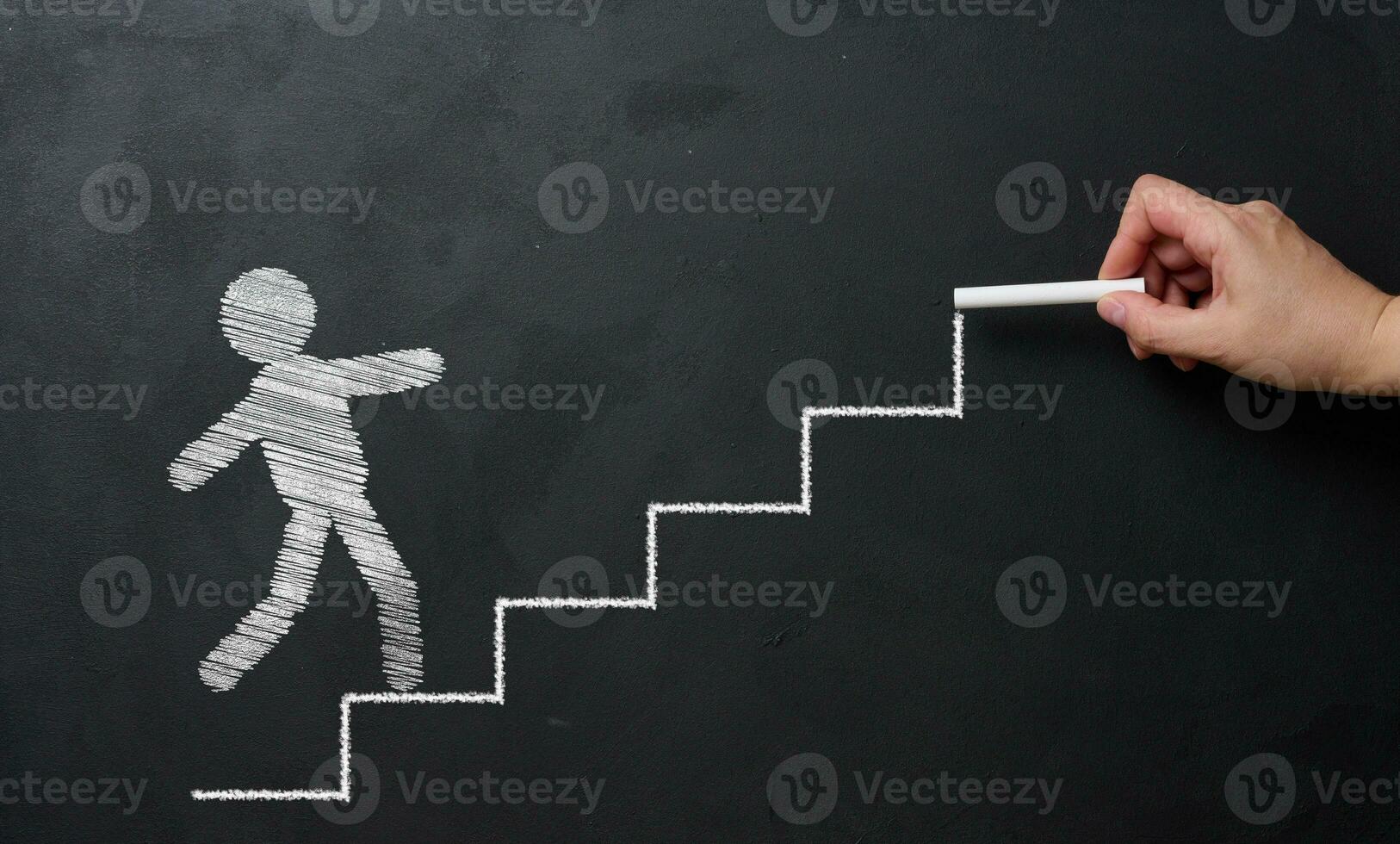 The chalk-drawn staircase goes up and the little man goes forward. Goal achievement concept photo