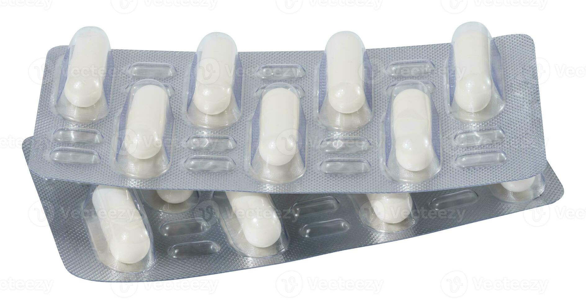 Oval white tablets in blister pack on a white isolated background photo
