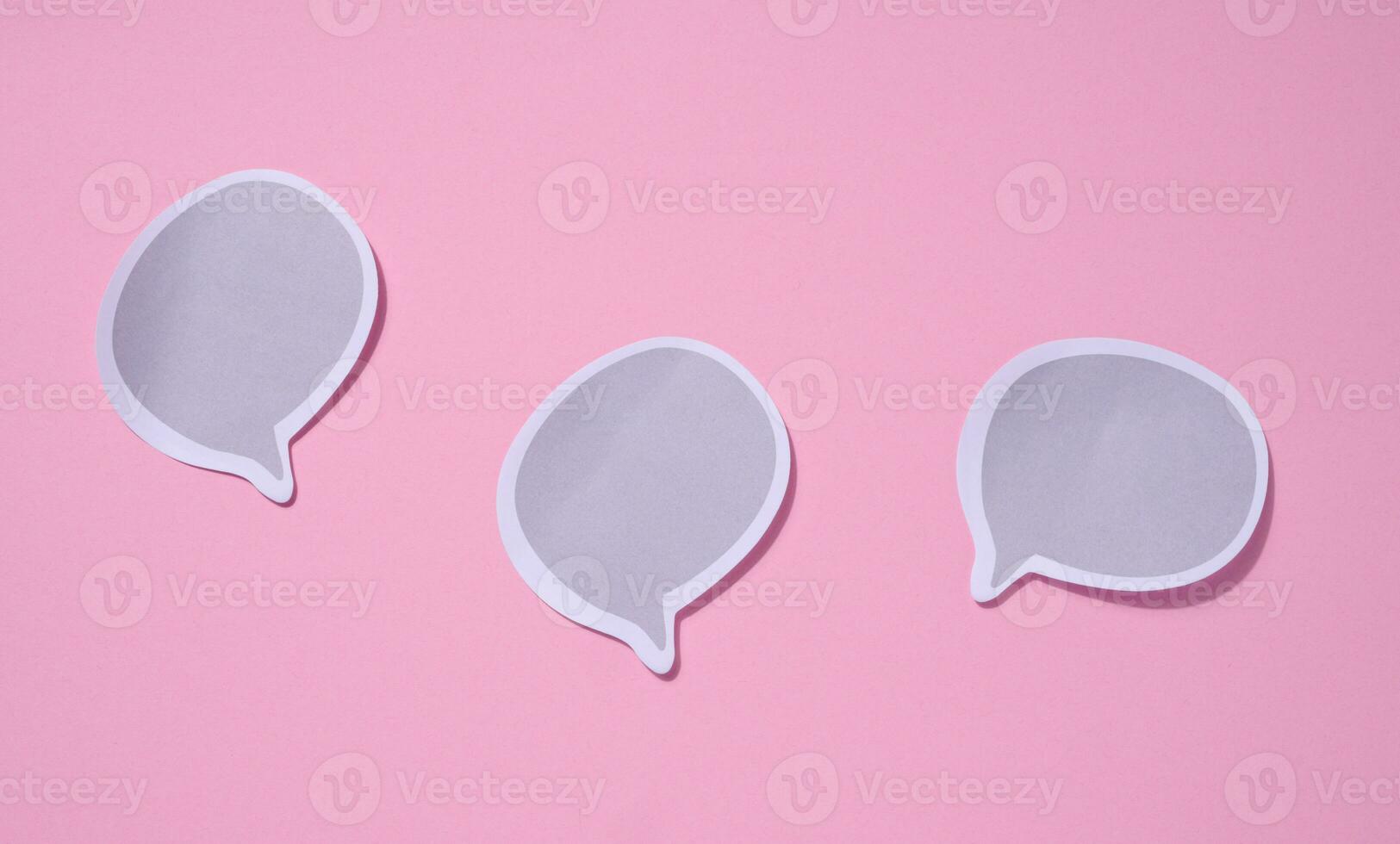 Blank paper stickers in cloud shape on pink background photo