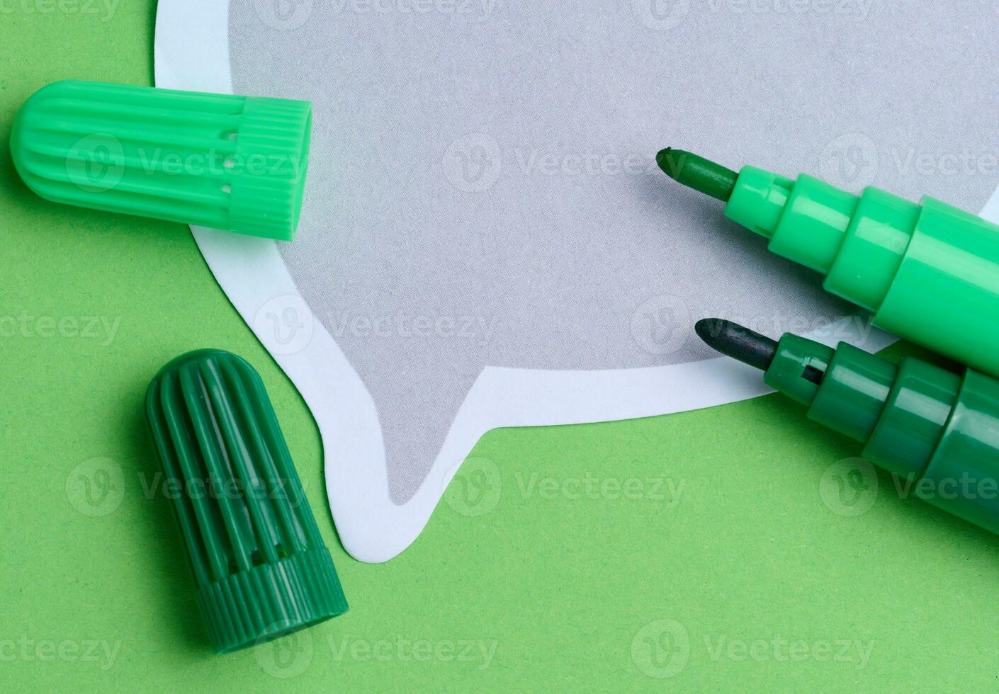 Green and yellow markers on a green background, top view photo