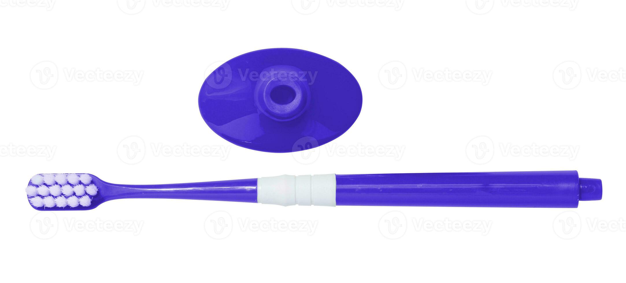Blue plastic toothbrush and stand on white isolated background, top view photo