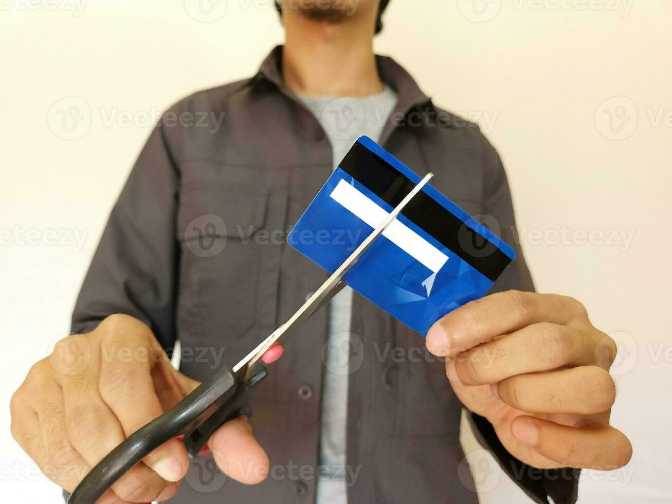 Cut credit card with scissors for stop to pay money protect crisis cost photo