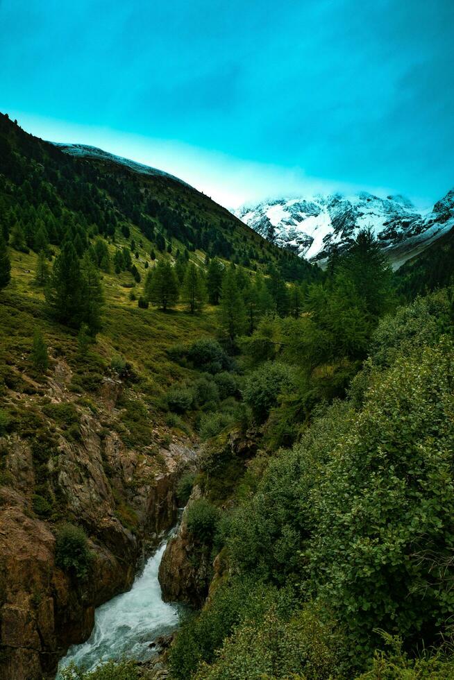 spectacular mountain landscapes of waterfalls and streams in Livigno in Valtellina on the border with Switzerland, in the summer of 2023 photo