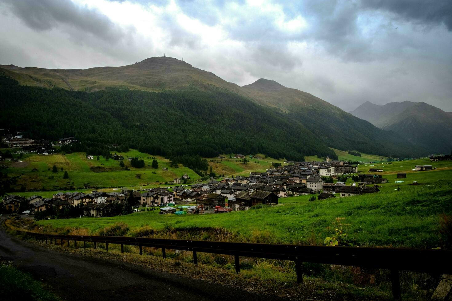 panorama of the town of Livigno, a mountain village in Valtellina on the border with Switzerland in July, summer 2023 photo