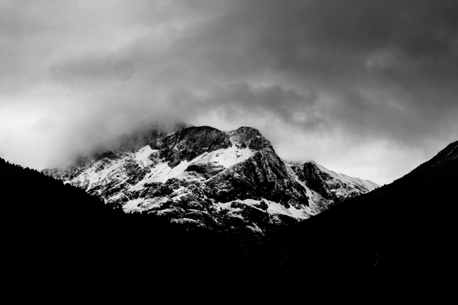 snow-filled mountain tops after a summer snowfall, in Livigno, Valtellina in the summer of 2023 photo