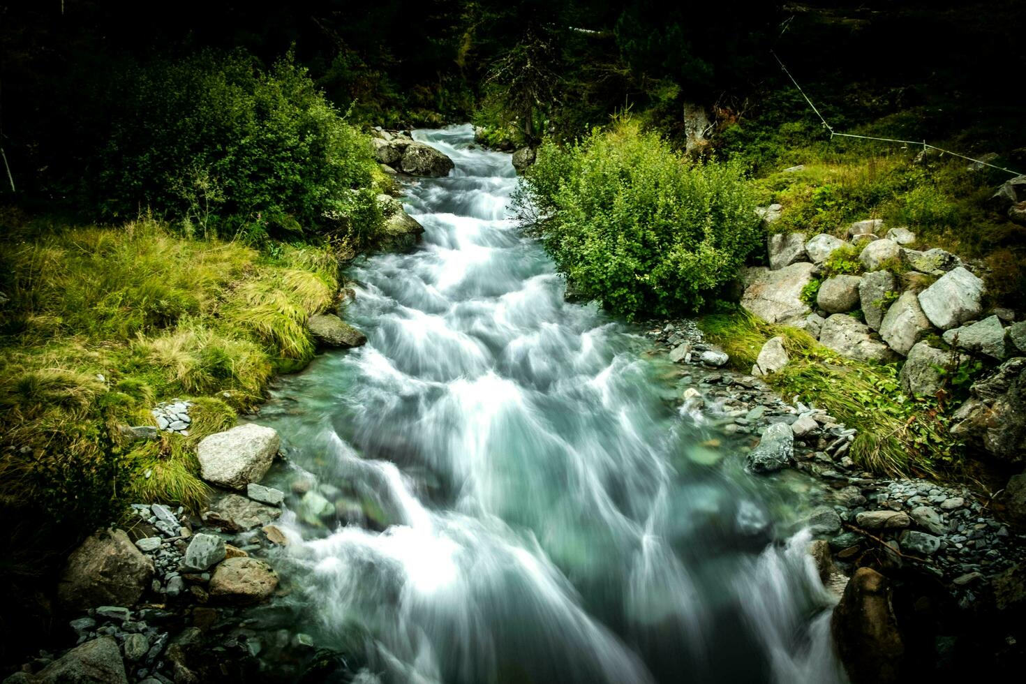 spectacular mountain landscapes of waterfalls and streams in Livigno in Valtellina on the border with Switzerland, in the summer of 2023 photo